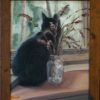 A black cat watching out the window, sitting in front of a mason jar of lavendar