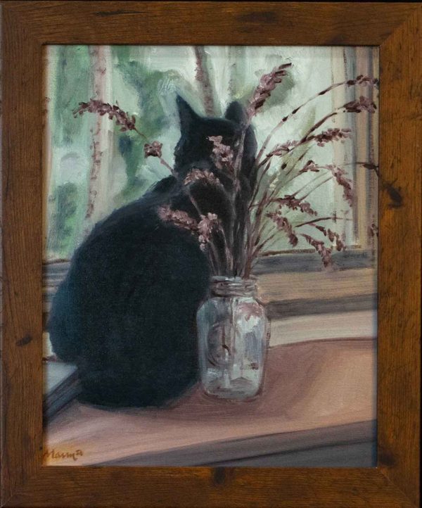 A black cat watching out the window, sitting in front of a mason jar of lavendar