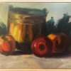 Antiwue copper bucket with apples on a table before it