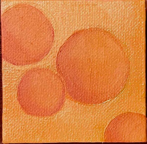 Four orange spheres